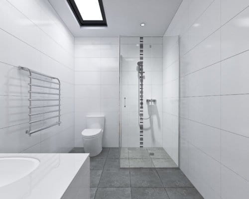 Glass door shower room, toilet bowl, steel rack with gray colored tiles.